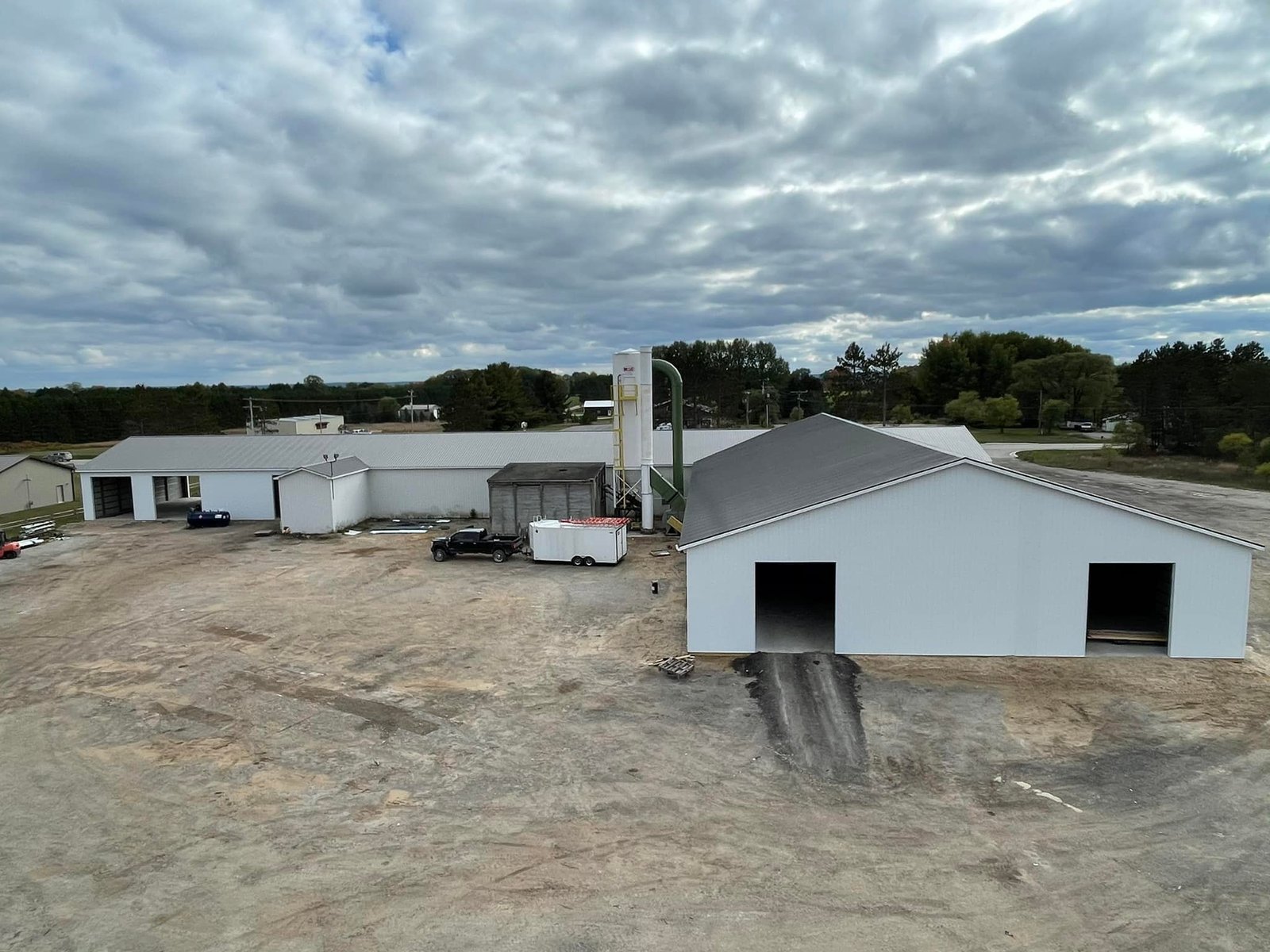 Finished white pole barn exterior